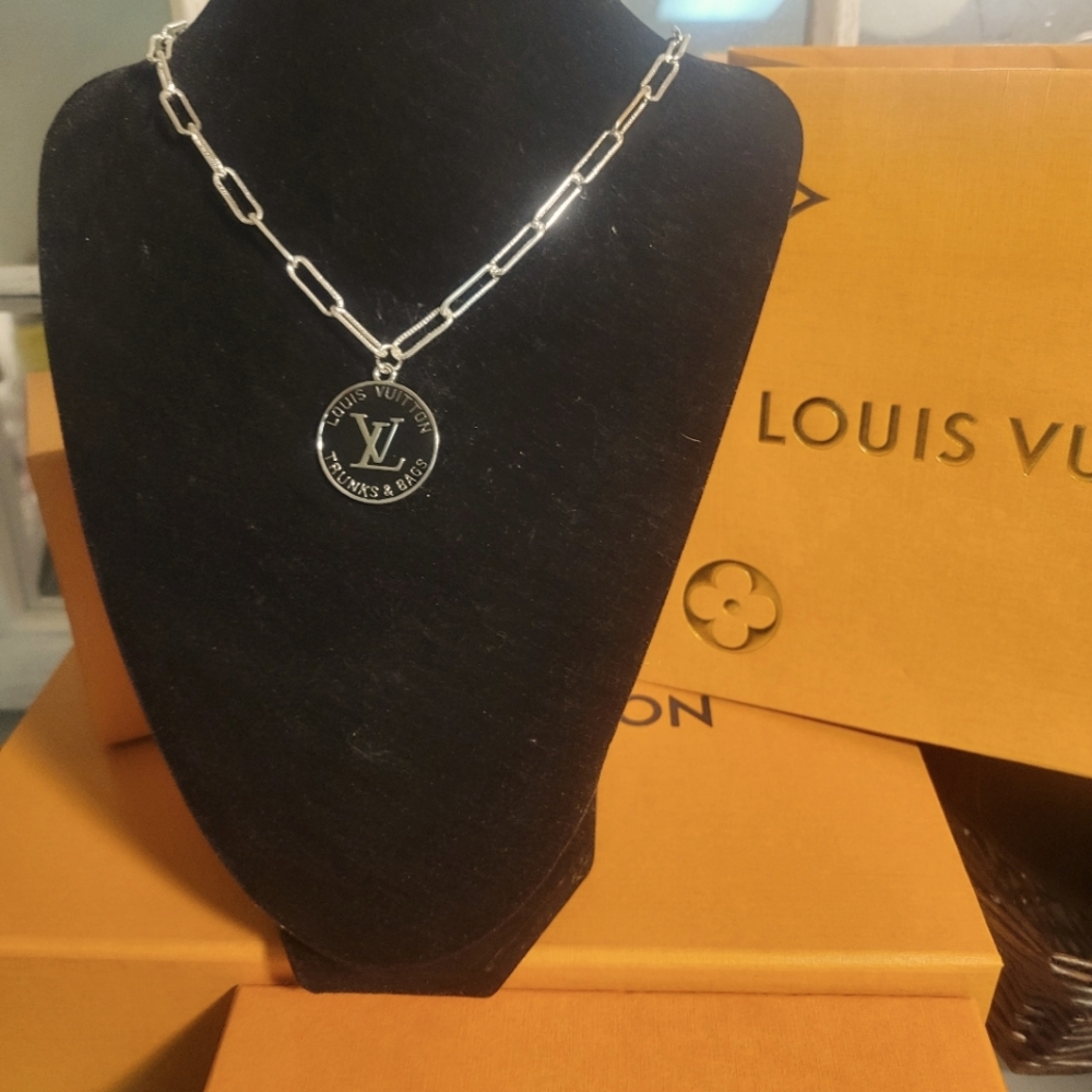 Louis Vuitton Silver Necklace with unbranded chain.,